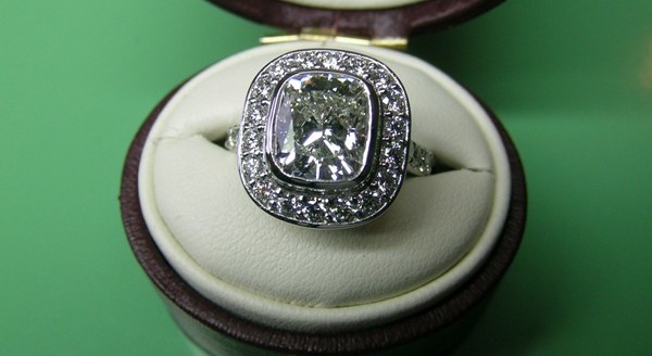 Two carat cushion cut diamond platinum halo engagement ring