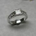 Solitaire princess cut diamond engagement ring with shoulder stones