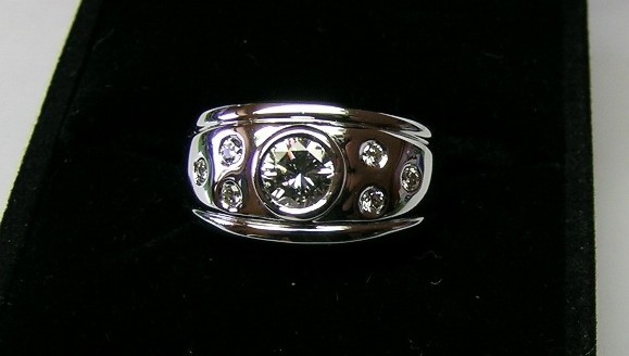 Contemporary bezel set brilliant cut diamond dress ring