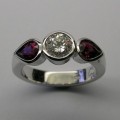 Brilliant cut diamond and pear shaped rubies dress ring