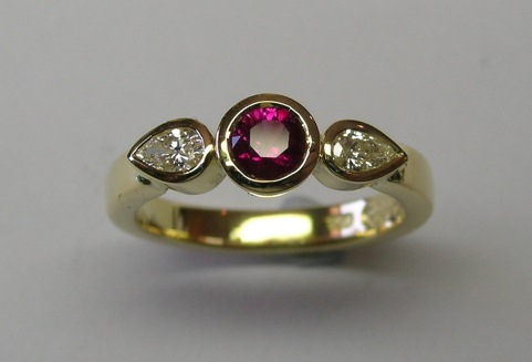 Natural Burmese ruby and pear shaped diamond dress ring