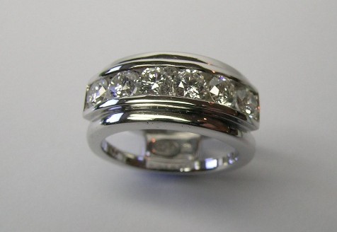 Stylish channel set brilliant cut diamond dress ring