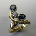 Contemporary style sapphire and diamond ladies ring