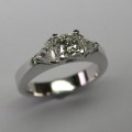 Radiant and trilliant cut diamond engagement ring