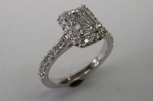 Emerald cut diamond platinum halo engagement ring