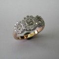 Antique style flower design three brilliant cut diamond dress ring
