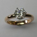 Platinum and rose gold solitaire round brilliant cut diamond ring