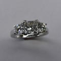 Platinum princess cut and round diamond trilogy engagement ring