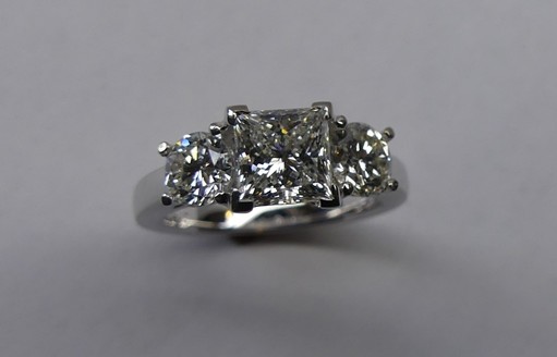 Platinum princess cut and round diamond trilogy engagement ring