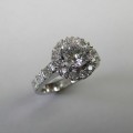 Platinum round brilliant and princess cut diamond halo engagement ring