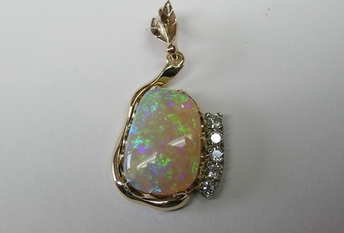 Solid opal and diamond pendant