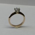 Solitaire round brilliant cut diamond and rose gold engagement ring