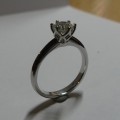 Platinum claw set solitaire diamond engagement ring