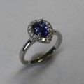 Pear shaped Ceylon Sapphire and Diamond halo engagement ring