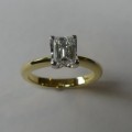 Emerald cut solitaire diamond engagement ring