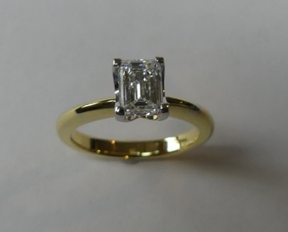 Emerald cut solitaire diamond engagement ring