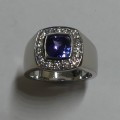Cushion cut tanzanite and diamond engagement ring