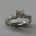Solitaire diamond platinum engagement ring with twisted diamond band